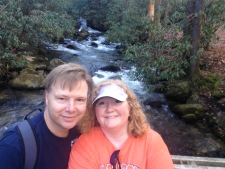 Anna Maria and Jeff Gilstrap in front of mountain creek