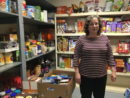 Shepherd's Gate Kitchen Manager Carrie Seils works to ensure healthy choices are available in the shelter's pantry.